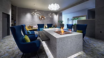 EcoSmart Fire Square 22 Fire Pit Kit brings vent-free bioethanol flames to Lexus Kamisu reception lounge table.